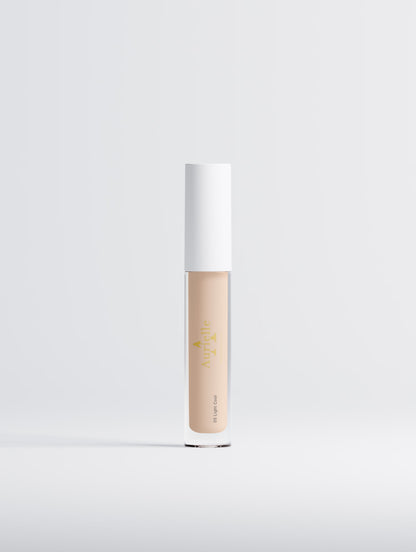 Cosmetic concealer bottle on a light gray background