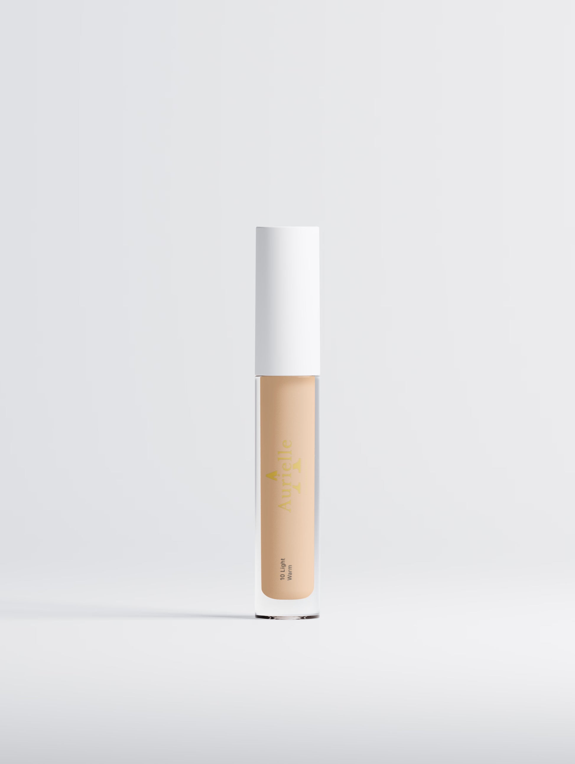Cosmetic concealer stick with white cap on a light gray background